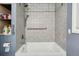 Bathroom with tiled walls, hand-held shower and grab bar at 3024 Bob Cox Rd, Marietta, GA 30064