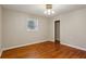 Bedroom featuring hardwood floors, neutral paint, a ceiling fan and a window at 3024 Bob Cox Rd, Marietta, GA 30064