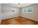 Bedroom featuring hardwood floors and two large windows at 3024 Bob Cox Rd, Marietta, GA 30064