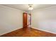 Bedroom with neutral walls, wood floors and door leading to other rooms at 3024 Bob Cox Rd, Marietta, GA 30064