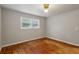 A bedroom featuring hardwood floors and a window that offers lots of light at 3024 Bob Cox Rd, Marietta, GA 30064