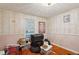 Bedroom with wood floors, neutral walls, and a window, providing a simple and cozy space at 3024 Bob Cox Rd, Marietta, GA 30064