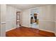 A dining room with hardwood floors is shown with a partial view of the adjacent kitchen at 3024 Bob Cox Rd, Marietta, GA 30064