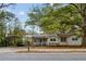 Inviting home exterior with a carport and mature trees, offering shade and curb appeal at 3024 Bob Cox Rd, Marietta, GA 30064