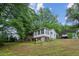 Charming single-story home featuring a sunroom, elevated foundation and private driveway at 3024 Bob Cox Rd, Marietta, GA 30064