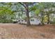 Charming home exterior with a carport and mature trees, offering shade and curb appeal to the property at 3024 Bob Cox Rd, Marietta, GA 30064