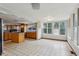 Spacious, open kitchen area with center island and vintage style flooring at 3024 Bob Cox Rd, Marietta, GA 30064