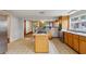 Spacious kitchen with center island, stainless steel appliances, and retro flooring at 3024 Bob Cox Rd, Marietta, GA 30064