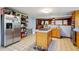 Spacious kitchen featuring stainless steel appliances, central island, and ample cabinet space at 3024 Bob Cox Rd, Marietta, GA 30064