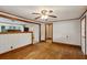 Living room with hardwood floors, wood trim, and view to an open kitchen at 3024 Bob Cox Rd, Marietta, GA 30064