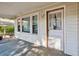 Inviting covered porch with windows and entry door, providing a welcoming outdoor space at 3024 Bob Cox Rd, Marietta, GA 30064