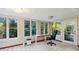 Bright sun room with large windows, natural light and desk at 3024 Bob Cox Rd, Marietta, GA 30064