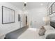 Bright bedroom featuring art, an accent wall, and a view to another room at 371 Grant Se Cir # 1822, Atlanta, GA 30315