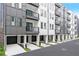 Modern townhome exteriors showing the garages and balconies at 371 Grant Se Cir # 1822, Atlanta, GA 30315