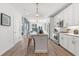 Modern kitchen showcasing white cabinets, stainless steel appliances, and an island with seating and pendant lighting at 371 Grant Se Cir # 1822, Atlanta, GA 30315