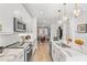 Modern kitchen with stainless steel appliances, white cabinetry, and open layout into the living area at 371 Grant Se Cir # 1822, Atlanta, GA 30315
