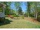 Manicured backyard with colorful azaleas and garden beds, providing a tranquil outdoor space at 11050 Linbrook Ln, Duluth, GA 30097