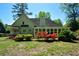 Picturesque backyard with mature trees and colorful azaleas, perfect for outdoor enjoyment at 11050 Linbrook Ln, Duluth, GA 30097