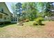 Expansive backyard with verdant lawn and natural landscaping, enhancing privacy and serenity at 11050 Linbrook Ln, Duluth, GA 30097