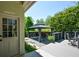 A backyard featuring a gazebo and deck with outdoor seating next to the garage access door at 11050 Linbrook Ln, Duluth, GA 30097