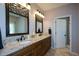 Large bathroom features a double granite vanity, tile floors and a view of the walk-in shower at 11050 Linbrook Ln, Duluth, GA 30097