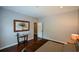 Cozy bedroom featuring hardwood floors, neutral walls, and a comfortable bed with patterned bedding at 11050 Linbrook Ln, Duluth, GA 30097