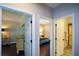 Hallway view showcasing doorways to the bedroom, bathroom, and other living spaces at 11050 Linbrook Ln, Duluth, GA 30097