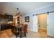 Kitchen island with granite countertop, seating, and stainless steel appliances nearby at 11050 Linbrook Ln, Duluth, GA 30097