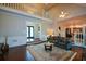 Open concept living room with vaulted ceilings, hardwood floors, and elegant staircase at 11050 Linbrook Ln, Duluth, GA 30097