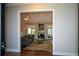 View of the living room with hardwood floors, ceiling fan, and French doors at 11050 Linbrook Ln, Duluth, GA 30097