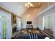 Spacious living room featuring vaulted ceilings, fireplace, and a comfortable seating area at 11050 Linbrook Ln, Duluth, GA 30097