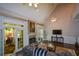 Bright and spacious living room with fireplace and french doors leading to the backyard at 11050 Linbrook Ln, Duluth, GA 30097