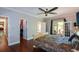 Main bedroom featuring hardwood floors, access to an outdoor patio, and a walk-in closet at 11050 Linbrook Ln, Duluth, GA 30097