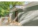Cozy back porch shows access to the home and a relaxing, shaded outdoor retreat with privacy at 1404 E Forrest Ave, Atlanta, GA 30344