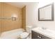 This bathroom offers a vanity, storage, shower and tub combo, and updated hardware at 1404 E Forrest Ave, Atlanta, GA 30344