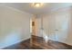 This bedroom offers gleaming hardwood floors, a closet, and neutral paint at 1404 E Forrest Ave, Atlanta, GA 30344