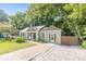 Charming bungalow with fresh paint, a manicured lawn, and a private drive offers comfort and style at 1404 E Forrest Ave, Atlanta, GA 30344