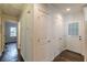 Hallway boasts hardwood floors and access to various rooms, including a door to the outside at 1404 E Forrest Ave, Atlanta, GA 30344