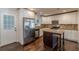 Modern kitchen with stainless steel appliances, granite countertops, and an island for extra workspace at 1404 E Forrest Ave, Atlanta, GA 30344