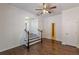 Cozy living room with hardwood floors, open staircase, and neutral paint provides comfort and style at 1404 E Forrest Ave, Atlanta, GA 30344