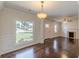 This living room offers gleaming hardwoods, neutral paint, and lots of natural light and architectural details at 1404 E Forrest Ave, Atlanta, GA 30344