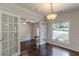 This living room offers hardwoods, natural light, and wainscotting at 1404 E Forrest Ave, Atlanta, GA 30344