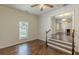 Bright living room features hardwood floors and a view into the fireplace, creating a warm, inviting space at 1404 E Forrest Ave, Atlanta, GA 30344