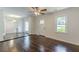 This living room offers gleaming hardwoods, neutral paint, and lots of natural light at 1404 E Forrest Ave, Atlanta, GA 30344