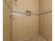 The tiled shower with mosaic accents and a recessed niche blends functionality with elegant style at 1404 E Forrest Ave, Atlanta, GA 30344