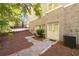 Basement entrance with double doors and a paved walkway, offering easy access and curb appeal at 1438 Sutters Pond Nw Dr, Kennesaw, GA 30152