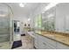 Bright bathroom with granite countertops, dual sinks and glass shower enclosure at 1438 Sutters Pond Nw Dr, Kennesaw, GA 30152