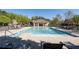 Inviting community pool area with lounge chairs and covered seating, perfect for relaxation and socializing at 1438 Sutters Pond Nw Dr, Kennesaw, GA 30152