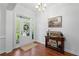 Welcoming foyer with a charming front door, hardwood floors, and elegant decor at 1438 Sutters Pond Nw Dr, Kennesaw, GA 30152