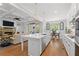 Open floor plan with living room and eat-in kitchen showcases a large island and stainless steel appliances at 1438 Sutters Pond Nw Dr, Kennesaw, GA 30152